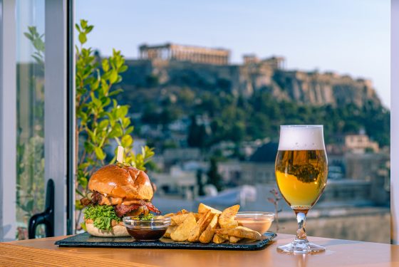 Burger, fries and a pint of beer with a view of the Acropolis